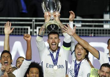 SERGIO RAMOS lifts the Super Cup trophy