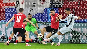 Portugal's forward #07 Cristiano Ronaldo shoots on target during the UEFA Euro 2024 Group F football match between Georgia and Portugal at the Arena AufSchalke in Gelsenkirchen on June 26, 2024. (Photo by INA FASSBENDER / AFP)