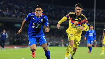Gabriel Fernandez (L) of Cruz Azul fights of the ball with Ramon Juarez (R) of America during the 13th round match between Cruz Azul and America as part of the Liga BBVA MX, Torneo Apertura 2025 at Olimpico Universitario Stadium, on October 18, 2025 in Mexico City, Mexico.