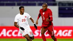 Soccer Football - International Friendly - Canada v Qatar - Estadio Franz Horr, Vienna, Austria - September 23, 2022 Canada's Jonathan David in action with Qatar's Abdelkarim Hassan REUTERS/Lisa Leutner