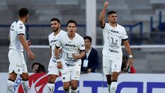 Guillermo Martinez (R) of Pumas celebrates after scoring against Santos during the Mexican Clausura tournament football match between Pumas and Santos at Olimpico Universitario stadium in Mexico City, Mexico, on February 18, 2024. (Photo by Rodrigo Oropeza / AFP)