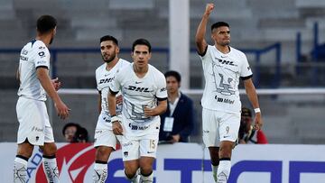 Guillermo Martinez (R) of Pumas celebrates after scoring against Santos during the Mexican Clausura tournament football match between Pumas and Santos at Olimpico Universitario stadium in Mexico City, Mexico, on February 18, 2024. (Photo by Rodrigo Oropeza / AFP)