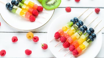 Fresh summer fruits on sticks. Studio shot