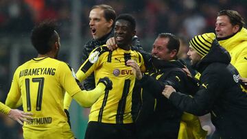 Soccer Football - Bayern Munich v Borussia Dortmund - DFB Pokal Semi Final - Allianz Arena, Munich, Germany - 26/4/17 Borussia Dortmund's Ousmane Dembele celebrates scoring their third goal with coach Thomas Tuchel and coaching staff Reuters / Michael Dalder Livepic DFL RULES TO LIMIT THE ONLINE USAGE DURING MATCH TIME TO 15 PICTURES PER GAME. IMAGE SEQUENCES TO SIMULATE VIDEO IS NOT ALLOWED AT ANY TIME. FOR FURTHER QUERIES PLEASE CONTACT DFL DIRECTLY AT + 49 69 650050 DFB RULES PROHIBIT USE IN MMS SERVICES VIA HANDHELD DEVICES UNTIL TWO HOURS AFTER A MATCH AND ANY USAGE ON INTERNET OR ONLINE MEDIA SIMULATING VIDEO FOOTAGE DURING THE MATCH.