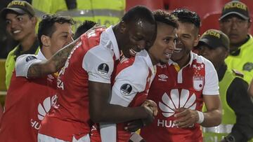 Colombia's Independiente Santa Fe player Arley Rodriguez (C) celebrates his goal against Colombia's Deportivo Cali, during their Copa Sudamericana