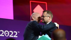 19 November 2022, Qatar, Al-Rajjan: Soccer, preparation for the World Cup in Qatar, FIFA press conference, FIFA President Gianni Infantino (l) hugs FIFA Media Director Bryan Swanson. Photo: Robert Michael/dpa (Photo by Robert Michael/picture alliance via Getty Images)