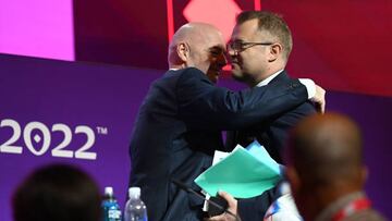 19 November 2022, Qatar, Al-Rajjan: Soccer, preparation for the World Cup in Qatar, FIFA press conference, FIFA President Gianni Infantino (l) hugs FIFA Media Director Bryan Swanson. Photo: Robert Michael/dpa (Photo by Robert Michael/picture alliance via Getty Images)