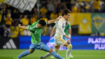 Nov 30, 2024; Carson, California, USA; LA Galaxy midfielder Riqui Puig (10) and Seattle Sounders FC defender Alex Roldan (16) battle for the ball in the first half in the 2024 MLS Cup Western Conference Final match at Dignity Health Sports Park. Mandatory Credit: Jayne Kamin-Oncea-Imagn Images