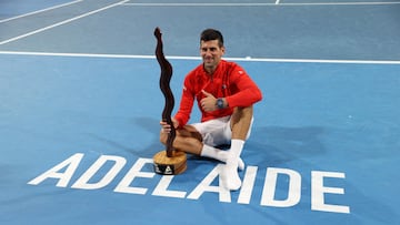 Tennis - Adelaide International - Memorial Drive Tennis Club, Adelaide, Australia - January 8, 2023 Serbia's Novak Djokovic celebrates with the trophy after winning the Adelaide International against Sebastian Korda of the U.S. REUTERS/Loren Elliott