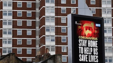 A UK government public health campaign message is displayed on a billboard in West London.