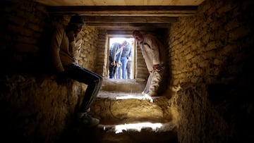 A man sits inside a tomb after the announcement of the discovery of 4,300-year-old sealed tombs, which have made a number of important archaeological discoveries dating to the fifth and sixth dynasties of the Old Kingdom, also stated that the expedition had found a group of Old Kingdom tombs, indicating that the site comprised a large cemetery, where the most important tomb belonged to Khnumdjedef, an inspector of the officials, a supervisor of the nobles, and a priest in the pyramid complex of Unas, the last kind of the fifth dynasty, in Egypt's Saqqara necropolis, in Giza, Egypt, January 26, 2023. REUTERS/Mohamed Abd El Ghany