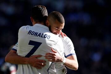 Real Madrid's Cristiano Ronaldo celebrates with his teammate Karim Benzema.