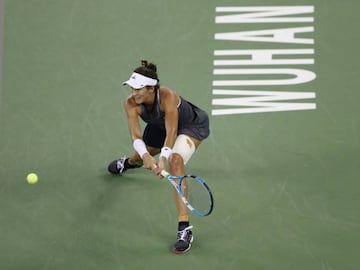 Muguruza's strapped leg a factor in defeat to Ostapenko.