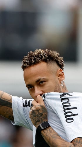 (FILES) Santos' forward Neymar greets fans during a tribute for scoring 150 goals for the club, before the Brasileirao Serie A football match between Santos and Cruzeiro at the Urbano Caldeira Stadium in Santos, Sao Paulo state, Brazil on December 7, 2025. Brazilian star Neymar returned to the pitch on February 15, 2026, after several weeks out due to knee surgery, just a few months before Brazil manager Carlo Ancelotti announces his squad for the World Cup. (Photo by Miguel Schincariol / AFP)