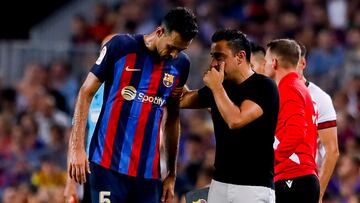 Sergio Busquets y 
Xavi Hernández