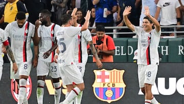 AC Milan's Argentine midfielder Luka Romero (R) celebrates scoring his team's second goal with teammates during the friendly football match between Real Madrid and AC Milan at the Rose Bowl in Pasadena, California, on July 23, 2023. (Photo by Frederic J. BROWN / AFP)