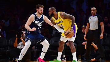 Jan 12, 2023; Los Angeles, California, USA; Los Angeles Lakers forward LeBron James (6) moves the ball against Dallas Mavericks guard Luka Doncic (77) during the first half at Crypto.com Arena. Mandatory Credit: Gary A. Vasquez-USA TODAY Sports