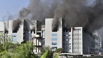 Smoke rises after a fire broke out at India's Serum Institute in Pune on January 21, 2021. - A fire broke out on January 21 at India's Serum Institute, the world's largest maker of vaccines, local TV footage showed, but media reports said production of the Covid-19 coronavirus vaccine was not affected. (Photo by - / AFP)