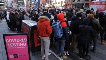 People queue for a COVID-19 test in Times Square as the Omicron coronavirus variant continues to spread in Manhattan, New York City, U.S., December 26, 2021. REUTERS/Andrew Kelly