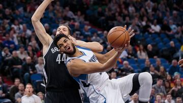 Jan 28, 2017; Minneapolis, MN, USA; Minnesota Timberwolves center Karl-Anthony Towns (32) shoots in the first quarter against the Brooklyn Nets guard Bojan Bogdanovic (44) at Target Center. Mandatory Credit: Brad Rempel-USA TODAY Sports