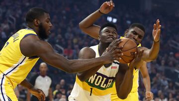 SAN FRANCISCO, CALIFORNIA - FEBRUARY 23: Zion Williamson #1 of the New Orleans Pelicans goes up for a rebound against Eric Paschall #7 and Kevon Looney #5 of the Golden State Warriors at Chase Center on February 23, 2020 in San Francisco, California. NOTE TO USER: User expressly acknowledges and agrees that, by downloading and or using this photograph, User is consenting to the terms and conditions of the Getty Images License Agreement.   Ezra Shaw/Getty Images/AFP
 == FOR NEWSPAPERS, INTERNET, TELCOS &amp; TELEVISION USE ONLY ==