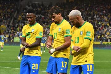 Lucas Paquetá (centre), Vinícius Júnior (left) and Neymar celebrate during Brazil's World Cup qualifying win over Colombia.