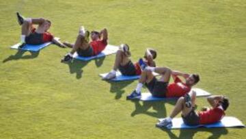 Algunos jugadores del Atleti, durante el entrenamiento de hoy.