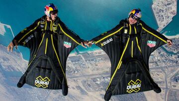 (FILES) In this file photo taken on March 25, 2017, wing-suit pilots Fred Fugen (R) and Vince Reffet fly over Dubai&#039;s Palm Islands. - Frenchman Vince Reffet, part of the &quot;Jetman&quot; team which performed groundbreaking stunts above Dubai using jetpacks and carbon-fibre wings, was killed in a training accident on November 17, 2020, a spokesman said. The Jetmen have pulled off a series of dramatic flights in the Gulf city, soaring in tandem above the world&#039;s tallest building Burj Khalifa, and alongside an Emirates Airbus A380, the world&#039;s largest commercial airliner. The accident, which happened at Reffet&#039;s Jetman base in the desert outside the city, is now under investigation. (Photo by Max HAIM / AFP)