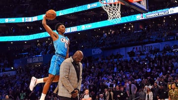 Feb 16, 2019; Charlotte, NC, USA; Oklahoma City Thunder forward Hamidou Diallo dunks over Shaquille O&#039;Neal in the Slam Dunk Contest during the NBA All-Star Saturday Night at Spectrum Center. Mandatory Credit:  Bob Donnan-USA TODAY Sports