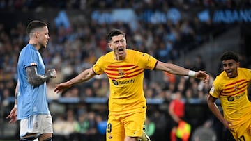 Barcelona's Polish forward #09 Robert Lewandowski celebrates scoring his team's first goal during the Spanish league football match between RC Celta de Vigo and FC Barcelona at the Balaidos stadium in Vigo on February 17, 2024. (Photo by MIGUEL RIOPA / AFP)