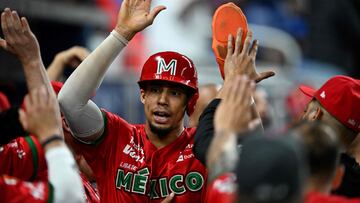 Mexico's outfielder #64 Aaron Altherr celebrates scoring a run during the Caribbean Series baseball game between Mexico and the Dominican Republic at LoanDepot Park in Miami, Florida, on February 4, 2024. (Photo by Chandan Khanna / AFP)