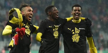 (L-R) Dortmund's Gabonese striker Pierre-Emerick Aubameyang, Dortmund's French midfielder Ousmane Dembele and Dortmund's Swedish striker Alexander Isak celebrate after during the German Cup DFB Pokal semifinal football match