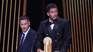 Real Madrid's English midfielder Jude Bellingham (R) speaks on stage as he recieves with the Kopa Trophy for best under-21 player next to Former Belgian midfielder Eden Hazard during the 2023 Ballon d'Or France Football award ceremony at the Theatre du Chatelet in Paris on October 30, 2023. (Photo by FRANCK FIFE / AFP)