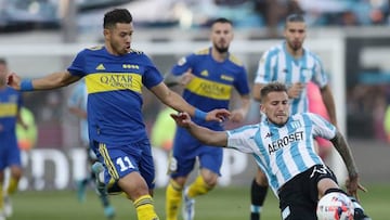 Racing Club's defender Gonzalo Piovi (R) is challenged by Boca Juniors' Paraguayan midfielder Oscar Romero during their Argentine Professional Football League semifinal match at Ciudad de Lanus stadium in Lanus, Buenos Aires, on May 14, 2022. (Photo by Alejandro PAGNI / AFP) (Photo by ALEJANDRO PAGNI/AFP via Getty Images)