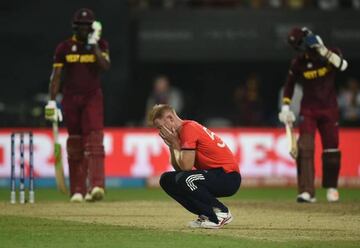 England's Ben Stokes reacts after being hit for consecutive sixes.