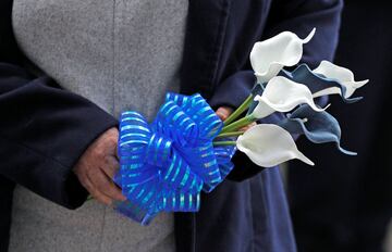 Leicester City football fans pay their respects outside the football stadium, after the helicopter of the club owner Thai businessman Vichai Srivaddhanaprabha crashed when leaving the ground on Saturday evening after the match, in Leicester, Britain, Octo