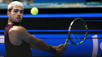 Spain's Carlos Alcaraz eyes the ball while competing against USA's Taylor Fritz during their men�s singles final match at the ATP Japan Open tennis tournament in Tokyo on September 30, 2025. (Photo by Philip FONG / AFP)