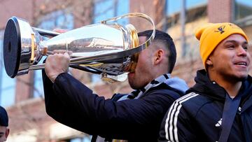 Dec 12, 2023; Columbus, OH, USA; Columbus Crew forward Christian Ramirez (17) drinks from the Philip F. Anschutz Trophy during a parade celebrating their 2023 MLS Cup victory. Mandatory Credit: Adam Cairns-USA TODAY Sports