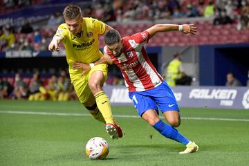 Foyth y Carrasco.