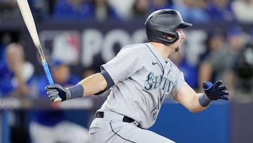 TORONTO, ONTARIO - OCTOBER 08: Cal Raleigh #29 of the Seattle Mariners hits an RBI single against Anthony Bass #52 of the Toronto Blue Jays during the eighth inning in game two of the American League Wild Card Series at Rogers Centre on October 08, 2022 in Toronto, Ontario. (Photo by Mark Blinch/Getty Images)