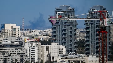 Smoke rises from the outskirts of the city following an Iranian projectile strike, amid the U.S.-Israeli conflict with Iran, in Tel Aviv, Israel, March 8, 2026. REUTERS/Dylan Martinez