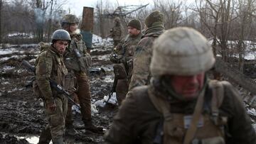 Servicemen of the Ukrainian Military Forces gather after fighting with Russian troops and Russia-backed separatists near the village of Zolote, in the Lugansk region on March 6, 2022.