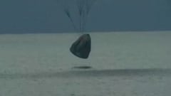 Where did the SpaceX capsule splashdown?