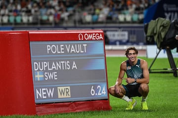 Sweden's Armand Duplantis poses for a photograph as he celebrates after setting a new pole vault world record (6.24m) during the Xiamen IAAF Diamond League athletics meeting at Egret Stadium in Xiamen, in China's eastern Fujian province, on April 20, 2024. 