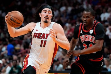 MIAMI, FLORIDA - APRIL 19: Jaime Jaquez Jr. #11 of the Miami Heat dribbles the ball against Javonte Green #24 of the Chicago Bulls during the Play-In Tournament at Kaseya Center on April 19, 2024 in Miami, Florida. NOTE TO USER: User expressly acknowledges and agrees that, by downloading and or using this photograph, User is consenting to the terms and conditions of the Getty Images License Agreement.   Rich Storry/Getty Images/AFP (Photo by Rich Storry / GETTY IMAGES NORTH AMERICA / Getty Images via AFP)