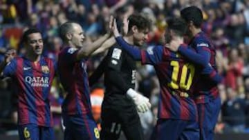 (L to R) Barcelona&#039;s midfielder Xavi Hernandez , Barcelona&#039;s midfielder Andres Iniesta , Barcelona&#039;s Argentinian forward Lionel Messi, Barcelona&#039;s Uruguayan forward Luis Suarez celebrate after scoring during the Spanish league football match FC Barcelona vs Rayo Vallecano de Madrid at the Camp Nou stadium in Barcelona on March 8, 2015.  AFP PHOTO / LLUIS GENE