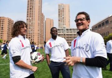 Puyol junto a Louis Saha y Fabio Capello durante el Laureus Shanghai Football Campus Tour 2015.