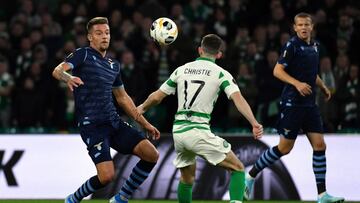 GLASGOW, SCOTLAND - OCTOBER 24: Sergej Milinkovic Savic of SS Lazio compete for the ball with Ryan Christie of Celtic FC during the UEFA Europa League group E match between Celtic FC and Lazio Roma at Celtic Park on October 24, 2019 in Glasgow, United Ki