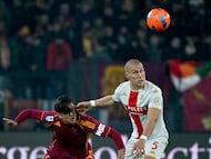 Roma's Argentine forward #21 Paulo Dybala (L) vies with Genoa's Ukrainian midfielder #17 Ruslan Malinovskyi (R) during the Italian Serie A football match between AS Roma and Genoa at the Olympic Stadium in Rome on December 29, 2025. (Photo by Filippo MONTEFORTE / AFP)