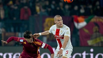 Roma's Argentine forward #21 Paulo Dybala (L) vies with Genoa's Ukrainian midfielder #17 Ruslan Malinovskyi (R) during the Italian Serie A football match between AS Roma and Genoa at the Olympic Stadium in Rome on December 29, 2025. (Photo by Filippo MONTEFORTE / AFP)